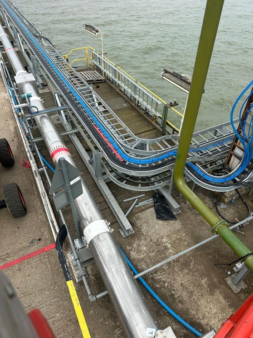 The finished cable runs in the cable ladder along the jetty, turning off the main run above the estuary