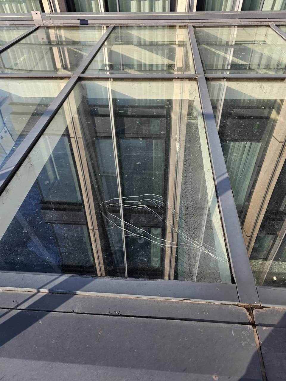 One of the two cracked panels in the atrium glazing, before it was surveyed